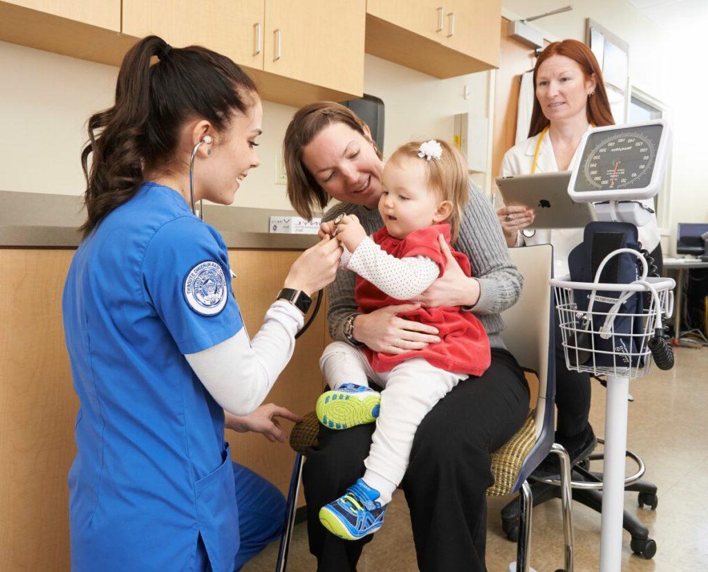 Nursing student with patient